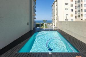 a swimming pool on the balcony of a building at Lucien Sands 602 in Margate