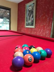 a group of billiard balls on a pool table at Pouso bom retiro in Paraty