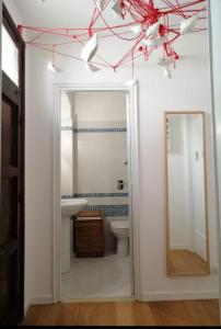 a bathroom with a toilet and a mirror at CasaNostra11 centro città e mare wifi 2 camere in Trapani