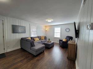 a living room with a couch and two chairs at Private Getaway In Midtown 2bedroom- SLEEP 5 in Atlanta