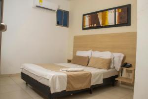 Postel nebo postele na pokoji v ubytování Hotel Central