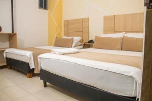 Postel nebo postele na pokoji v ubytování Hotel Central