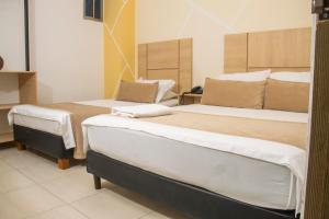 1 dormitorio con 2 camas en una habitación en Hotel Central, en Sincelejo
