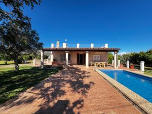 a villa with a swimming pool and a house at Villa en Llucmajor, Es Lluch in Llucmajor