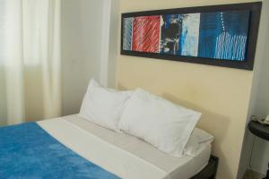 Postel nebo postele na pokoji v ubytování Hotel Central
