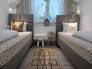 Postel nebo postele na pokoji v ubytování Ubytování pro rodiny s dětmi