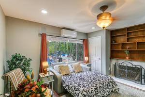 a bedroom with a bed and a fireplace at Anaheim Studio with Fireplace 14 Mi to Disneyland! in Anaheim +18 photos