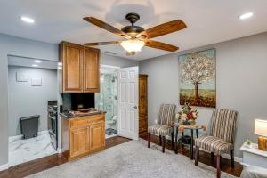 a living room with a ceiling fan and a tv at Anaheim Studio with Fireplace 14 Mi to Disneyland! in Anaheim