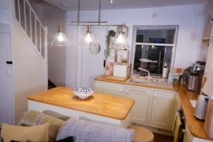 a kitchen with a table with a bowl on it at Water View Cottage, Conwy in Conwy