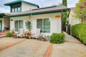 a house with chairs and flowers on a patio at Anaheim Studio with Fireplace 14 Mi to Disneyland! in Anaheim