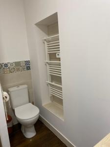 a bathroom with a toilet in an empty closet at Le Colibri - Domaine de la Houblette in Challans