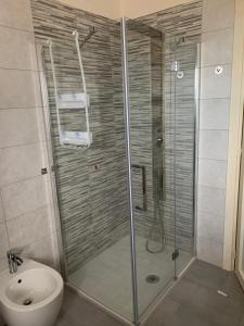 a shower in a bathroom with a toilet and a sink at le tamerici B&B in Ancona