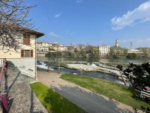 a view of a river in a city at Acqua Piatta - L'Ostello del Canoa in Ivrea