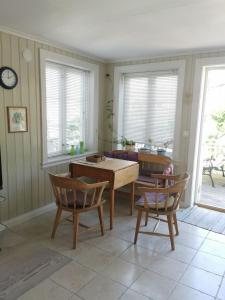 a living room with a table and two chairs at Great house in Risør centre in Risør