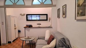 a living room with a couch and a table at Blue Breeze Apartment in Germignaga