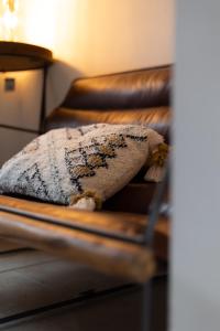 a pillow sitting on top of a couch at Chester Townhouse in the City Centre in Chester
