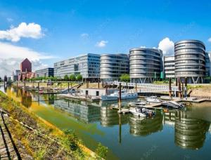 a view of a marina with buildings and boats at Keine Monteurswohnung in Duisburg