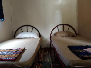 Katil atau katil-katil dalam bilik di Darvel Bay Homestay