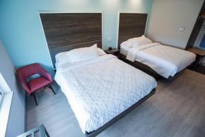 Tru By Hilton Cedar Rapids Westdale客房内的一张或多张床位