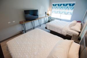 Tru By Hilton Cedar Rapids Westdale客房内的一张或多张床位