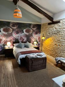 Säng eller sängar i ett rum på Le Vieux Renard
