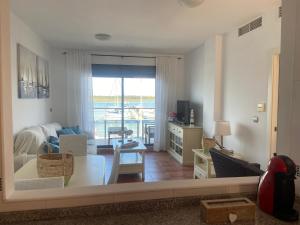a living room with a view of a living room at Puerto Deportivo in Punta Umbría +21 photos