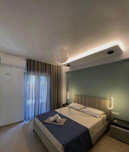 Ένα ή περισσότερα κρεβάτια σε δωμάτιο στο Infinito Blu Blu apartment