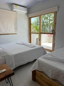 Säng eller sängar i ett rum på Mykonos Beach House