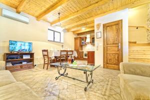 a living room with a table and a dining room at Villa Major near Vrsar and Lim Fjord in Marasi