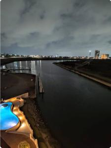 a view of a river with a swimming pool at Sol y mar in Boca del Río