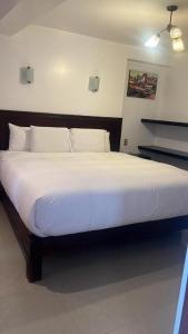 Krevet ili kreveti u jedinici u objektu Cusco Plaza Hotel