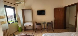 Postel nebo postele na pokoji v ubytování Hotel La Villa