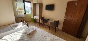Postel nebo postele na pokoji v ubytování Hotel La Villa