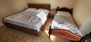 Postel nebo postele na pokoji v ubytování Hotel La Villa