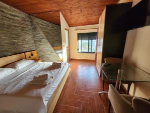 Postel nebo postele na pokoji v ubytování Hotel La Villa