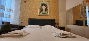 Postel nebo postele na pokoji v ubytování Hotel La Villa