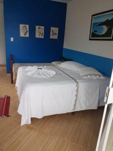 Postel nebo postele na pokoji v ubytování Suítes Encanto do Pai
