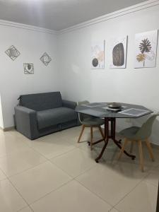 a living room with a table and a couch at Edificio del Sur in Santiago del Estero