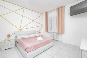 a bedroom with a bed and a mirror at Holidays in Lecco