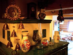 a group of vases on a counter in a room at Chaloupka Pod Kopřivnou in Malá Morávka