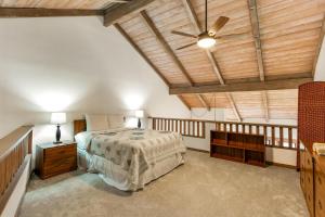 a bedroom with a bed and a ceiling fan at Waikomo Stream Villas 332 in Koloa +38 photos