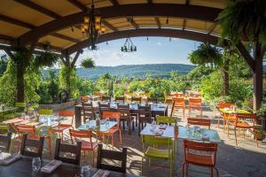 a restaurant with tables and chairs on a patio at 10 guest Ski Chalet Pools Golf Ski Hike in Vernon Township