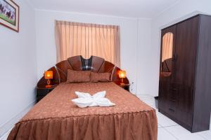 Postel nebo postele na pokoji v ubytování Hotel Residencial C´BASTIAN