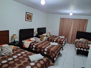 Postel nebo postele na pokoji v ubytování Hotel Residencial C´BASTIAN