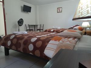 Postel nebo postele na pokoji v ubytování Hotel Residencial C´BASTIAN