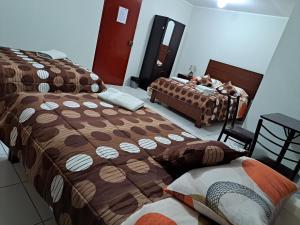 Postel nebo postele na pokoji v ubytování Hotel Residencial C´BASTIAN
