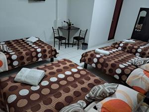 Postel nebo postele na pokoji v ubytování Hotel Residencial C´BASTIAN