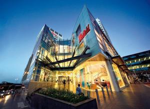 a building with a sign on the front of it at Stylish 1BR Haven in Bondi Junction in Sydney