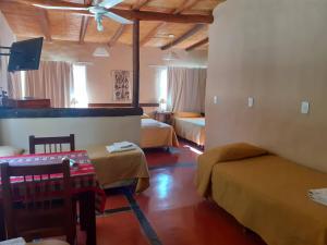 Ένα ή περισσότερα κρεβάτια σε δωμάτιο στο Hotel Punta Corral +82 φωτογραφίες