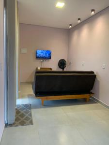 a room with a pool table and a tv on the wall at Sol de Corumbau in Corumbau